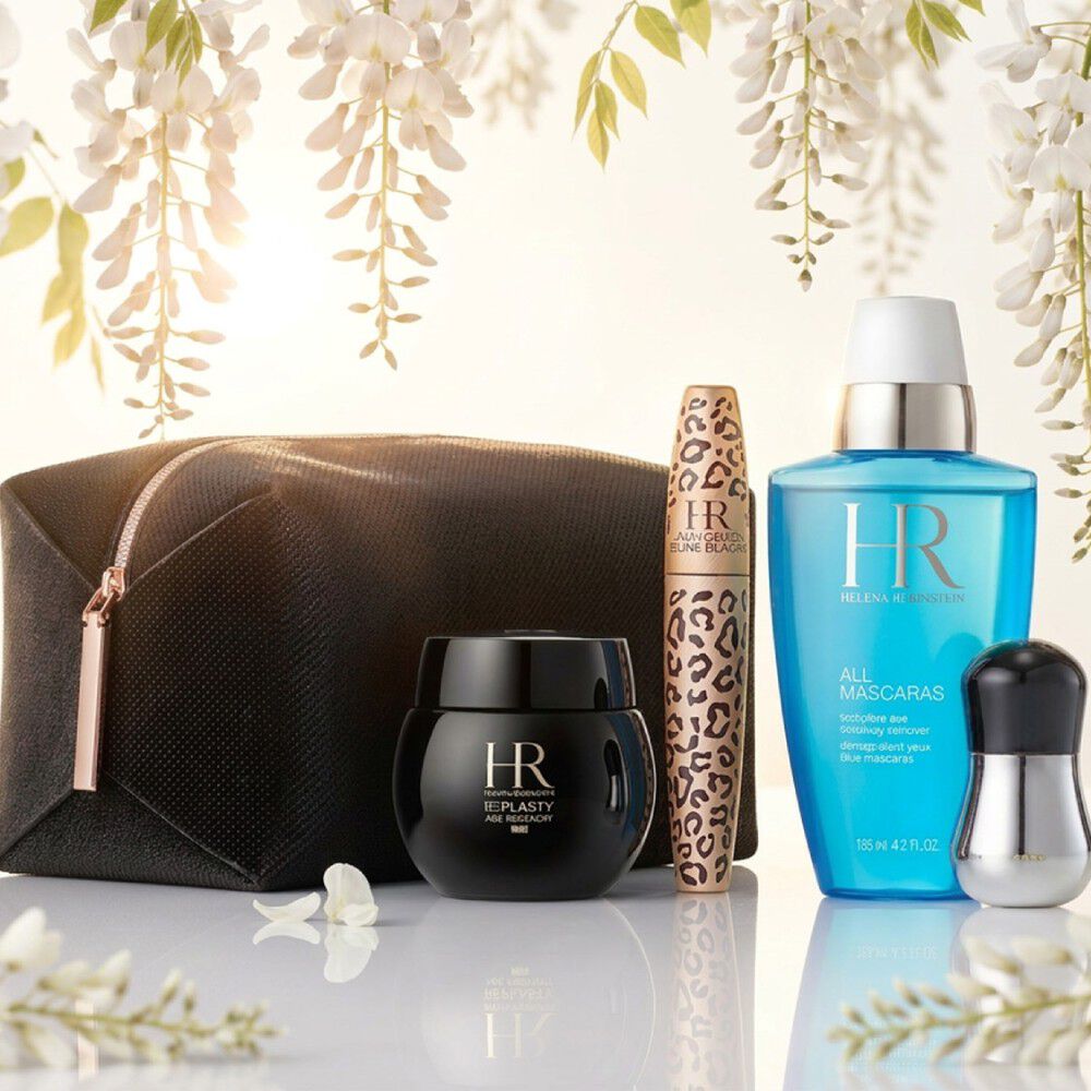 Prodotti Helena Rubinstein sotto glicini bianchi.​